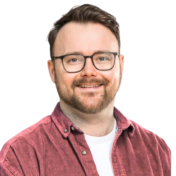 Ben Dowse smiling, in glasses and a red corduroy shirt