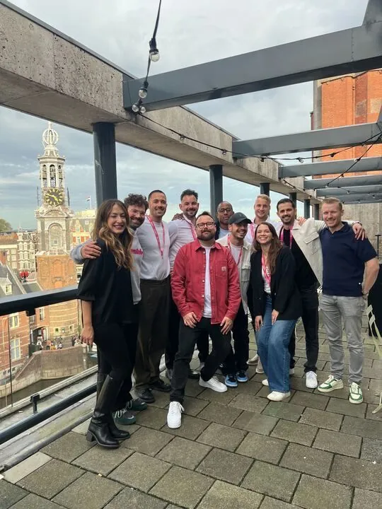 Ben with a team on a rooftop